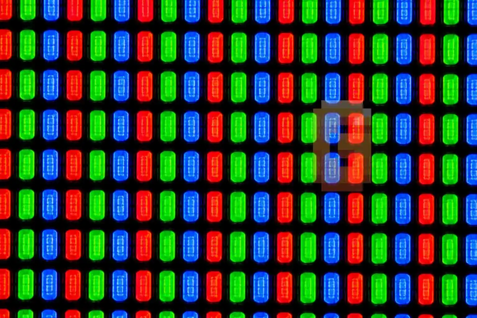 Close-up macro shot of organic sub-pixels on a modern OLED display panel